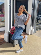 Load image into Gallery viewer, Medium Wash Mid Rise Fray Bottom Crop Jeans