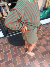 Load image into Gallery viewer, Women’s brown and green striped two-piece sweater set with relaxed long-sleeve top and matching drawstring skort.