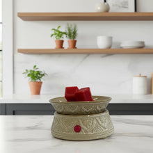 Load image into Gallery viewer, An ornate ceramic wax warmer with a beige floral pattern and a small red button.