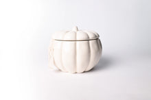 Load image into Gallery viewer, An off-white ceramic pumpkin-shaped lidded container with a ribbed texture and a small stem on top, shown on a clean white background.