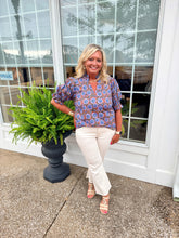 Load image into Gallery viewer, Blue Bloom Ruffle Sleeve Blouse! Lightweight cotton top features a beautiful floral print, feminine ruffle details at the neckline and sleeves, and a flattering split V-neckline