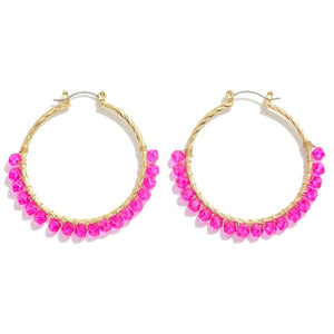 Gold Tone Twisted Drop Hoop Featuring Fuchsia Beaded Details